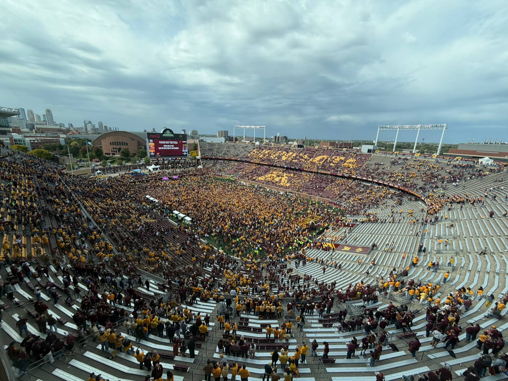 Gophers storm the field after claiming the Little Brown Jug - Bring Me ...